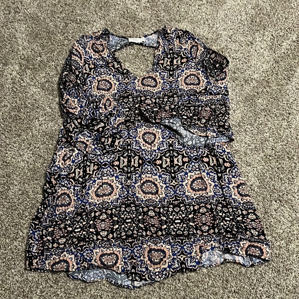 Lush dress with bell sleeve and back cutout detail. Worn once!